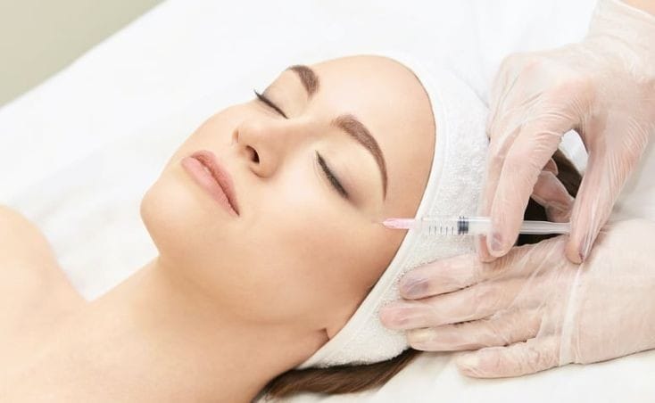 Skin booster injection treatment on face to improve collagen and skin hydration