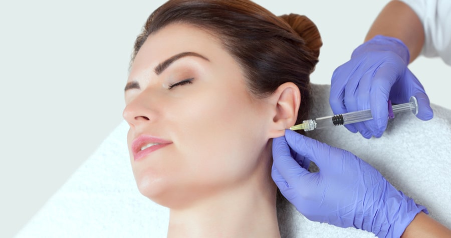 Earlobe repair before and after procedure with local anaesthesia before cosmetic earlobe repair.